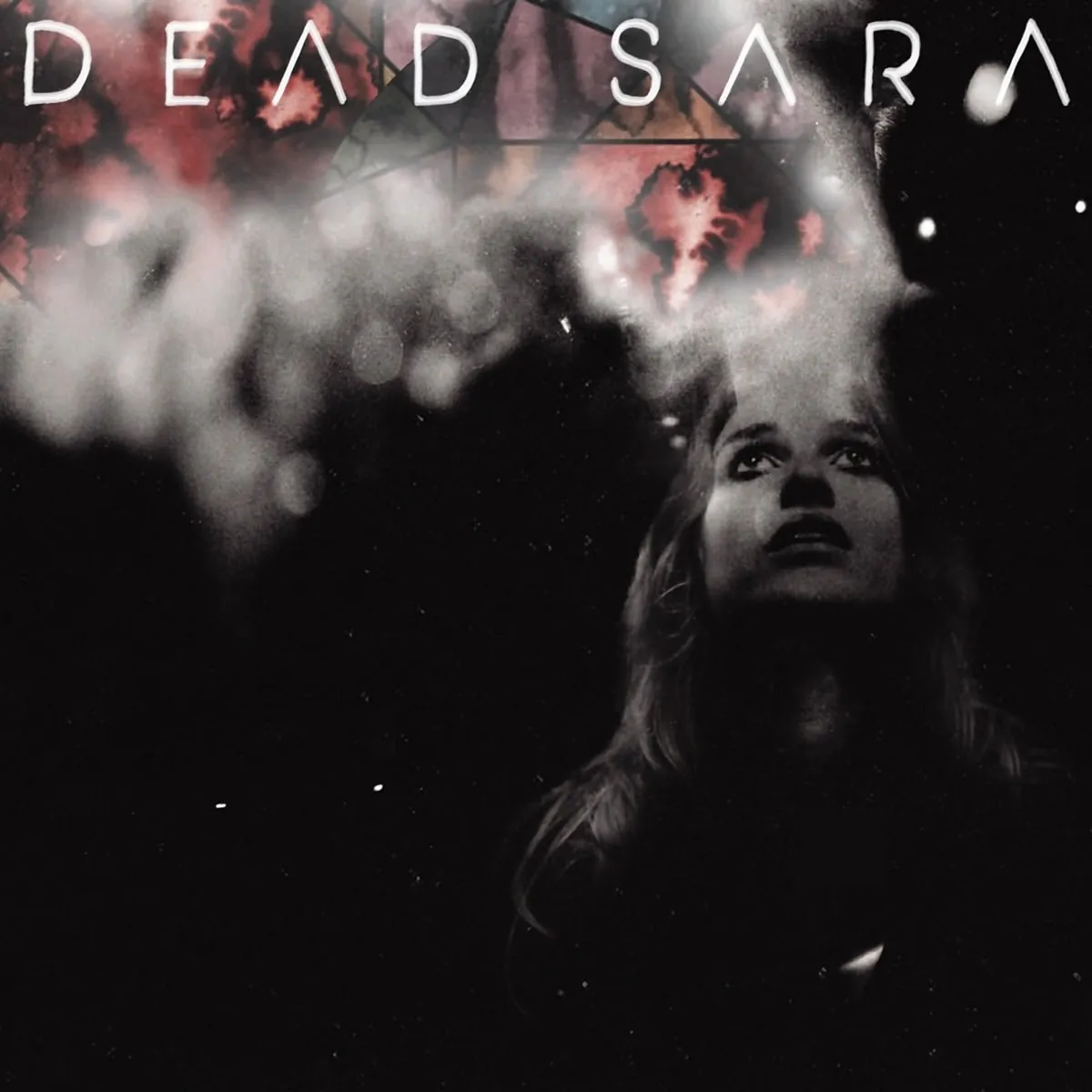 Album artwork: the DEAD SARA lettering above a figure whose face dissolves upward into smoke, on black